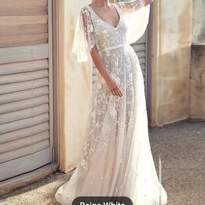 V neck bridal gown with wispy sleeves.